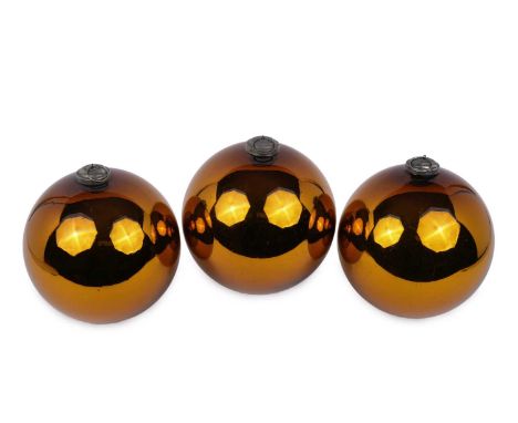Three vintage witches balls, in an amber mirrored finish, fitted with metal suspension rings, approximately 80cms circumferen