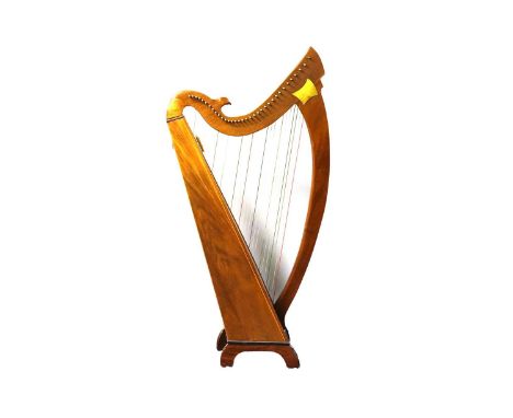 A hand-crafted hardwood Celtic style 36 string harp, 104 x 72cms. 