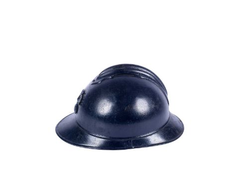 A First World War French Adrian helmet, steel with central comb and RF on Grenade badge, 30cms front to back.