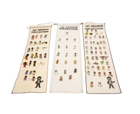 A collection of Robertson's advertising enamel badges, displayed pinned on wall hanging banners, approximately ninety-four in