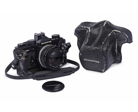 An Olympus OM-2 N SLR camera, fitted with a Zuiko 50mm f1.4 lens, in case.