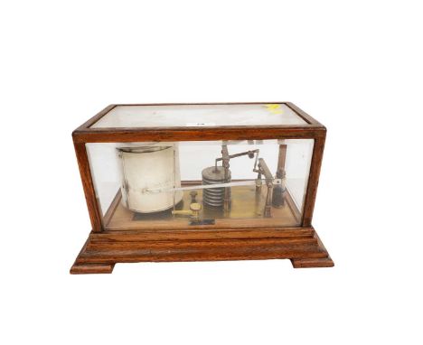 An early 20th Century oak cased barograph, supplied by T. B. Winter &amp; Son, Newcastle upon Tyne, with ink bottle, raised o