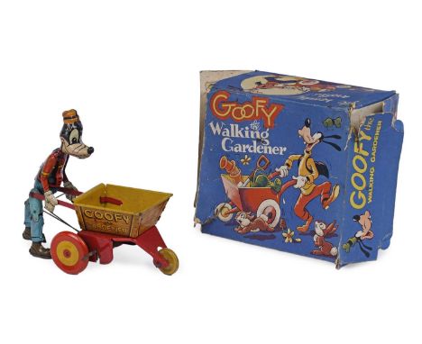 A Marx Toys 'Goofy The Walking Gardener' clockwork tinplate toy, modelled holding a wheelbarrow, 22 x 20cms high, with origin