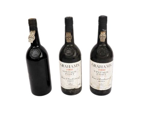Two bottles of Graham's 1980 vintage port, 75cl, 20 proof; together with, another bottle of Graham's 1975 vintage port, (miss