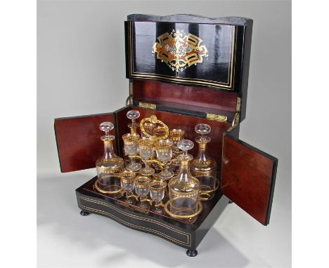19th Century ebonised and inlaid serpentine liquor box, with brass stringing, mother of pearl and kingwood inlay, the hinged 