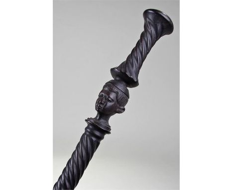 Early African ebony craved figural walking stick/cane, the domed top above barley twist tapering shaft, finely carved head to