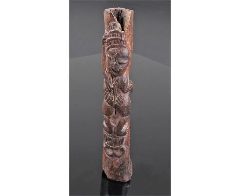 Unusual African carved bone idol, of a figure standing on a stool, 13.5cm high