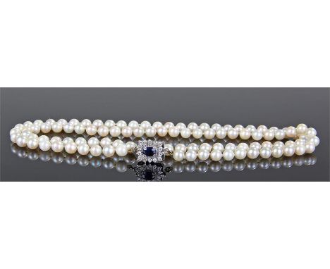 Pearl sapphire and diamond set necklace, the row of pearls with a sapphire and diamond set clasp, mounted on white metal, tot