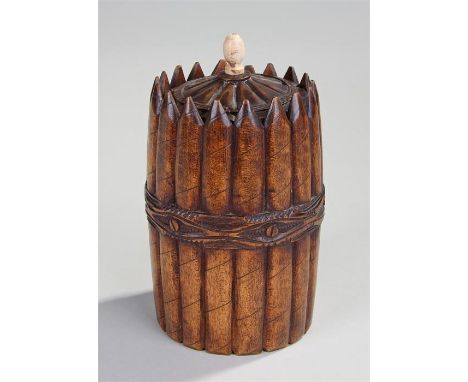 Early 19th Century oak cigar box, the lid with a turned boned finial, the carved boxy in the form of bound sticks, 18cm high,