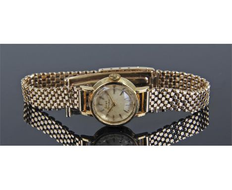 Girard Perregaux ladies 18 carat gold wristwatch, with circular dial, manual wind, with baton hours, on a 14 carat gold brace