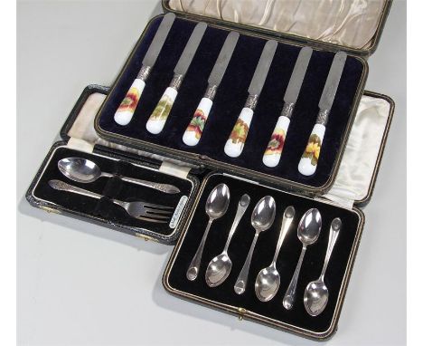 Three cased cutlery sets, the first set with porcelain handles, makers to the blade Levesley Bros, Sheffield, a cased set if 