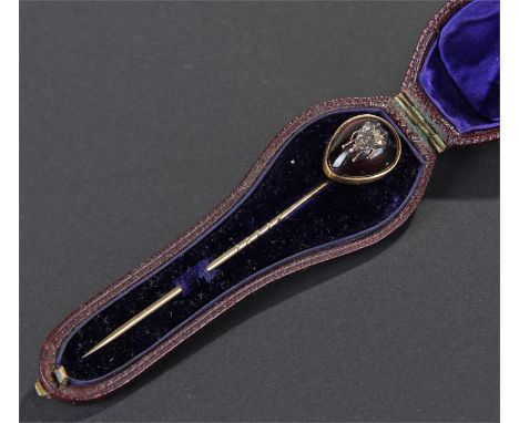 Victorian diamond insect set garnet stick pin, the large garnet with applied diamond set fly, 14mm diameter, cased