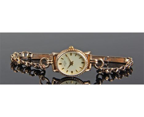 Rotary 9 carat gold ladies wristwatch, the champagne dial with gilt baton hours, housed with a 9 carat gold case and strap, d