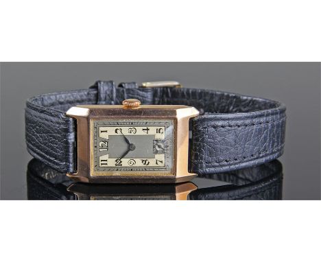 Gentleman's 9 carat gold wristwatch, the silvered dial with Arabic hours, 9 carat gold canted angled case, manual wound, case