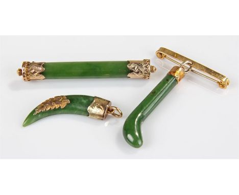 Three New Zealand jade and yellow metal mounted pieces, to include a brooch and two pendants, (3)
