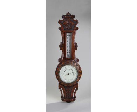 Early 20th Century oak aneroid barometer, with leaf carved pediment above a mercury thermometer and weather gauge, 65cm high
