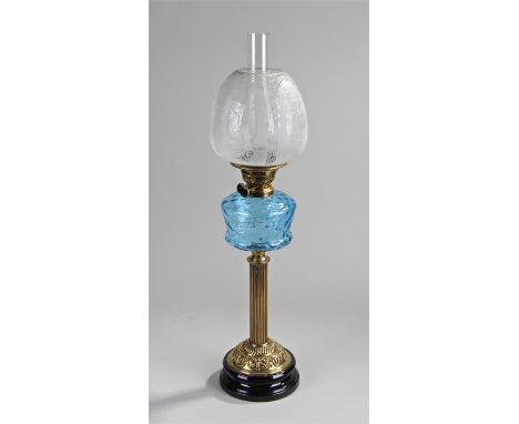 Victorian oil lamp, the etched shade above a clear blue font and reeded base, 72cm high