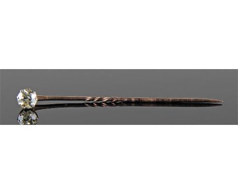 Single diamond set stick pin, the single diamond at approximately 0.80 carat, raised on a gold pin