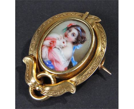 19th Century French enamel miniature, the polychrome painted miniature with a young lady holding a rabbit, housed within a ye