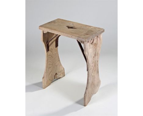 Late 18th Century Gothic revival elm stool, the rectangular top with pierced central hole, shaped supports mounted with angle