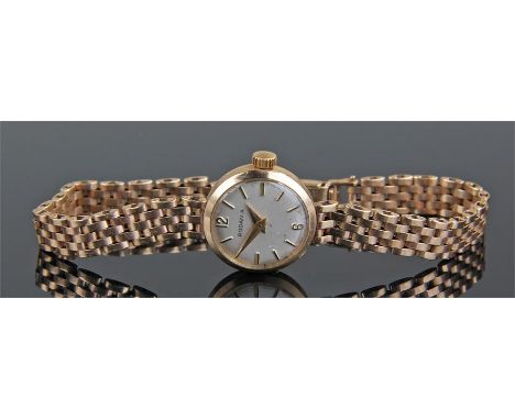 Rodania 9 carat gold wristwatch, the silvered dial with baton hours, 9 carat gold bracelet strap, case 17mm diameter