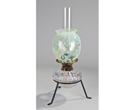 Victorian oil lamp, the olive green 'horse chestnut leaf' pattern vaseline glass shade above a clear glass font, raised on a 