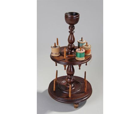 Victorian Scottish laburnum cotton reel holder, with a cup above a turned column, two tiers of cotton reel holders, raised on