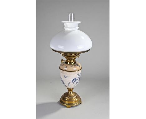 Victorian pottery oil lamp, Wiltshaw & Robinson Ltd, circa 1890, with a broad milk glass shade, foliate blue decorated potter