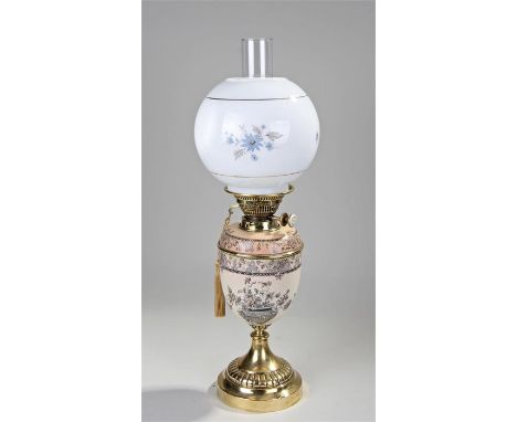 Victorian Royal Doulton oil lamp the glass shade with painted flowers above a blush ivory Royal Doulton base, raised on a gad