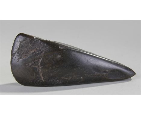 New Zealand Maori axe head, the pointed end tapering, 18cm long