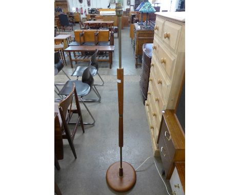 A teak standard lamp