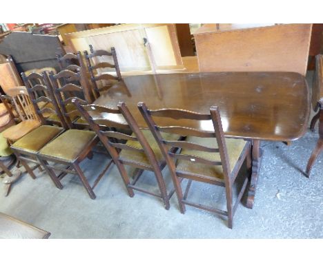 An Ercol refectory table and six chairs