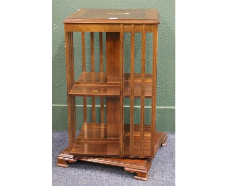 Mahogany and inlaid two tier revolving bookcase, raised on bracket supports, height 81 cm, width 47 cm. 