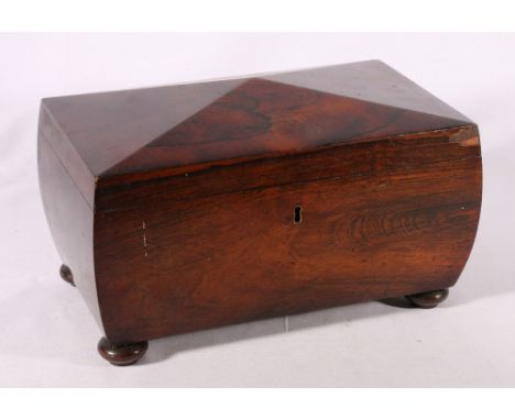 19th century rosewood tea caddy of sarcophagus form raised on turned bun feet, 32cm wide 