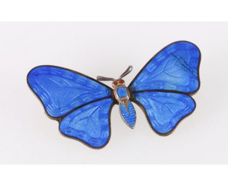 Blue enamelled butterfly brooch with orange stone set eyes.CONDITION REPORT:No losses to the enamel, reverse is very dirty.