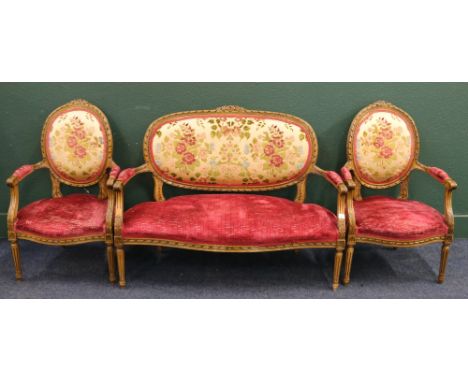 Oak 20th Century carved three piece bergere suite with floral upholstered back, the suite comprising of two open armchairs an