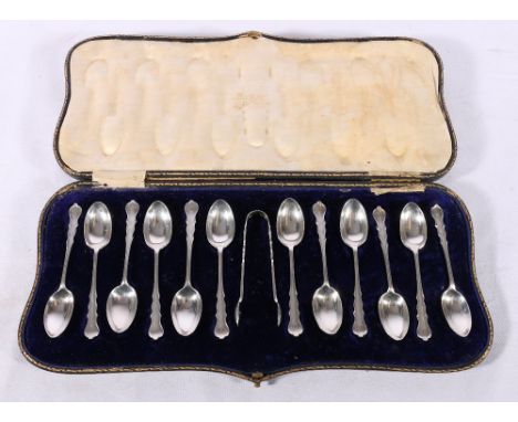 Set of twelve Edward VII Art Nouveau silver teaspoons and tongs London 1907 by&nbsp;Josiah Williams &amp; Co (George Maudsley