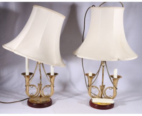 Pair of brass table lamps with twin bugle support, 36cm tall 