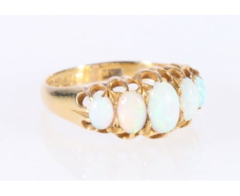 18ct yellow gold five stone opal dress ring in claw setting, 3.1g, size N. 