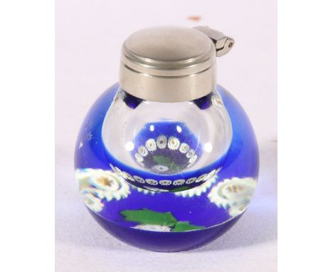 Caithness art glass millefiori inkwell of "Thistle" pattern with white metal mounts, 7cm tall 