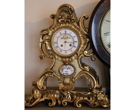French Rococco style mantle clock with porcelain panel and visible escapement, 50cm tall 
