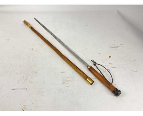 19th century Swordstick with tapered steel blade, turned horn knop and brass mounts, blade 55.5cm in length, 76cm overall.