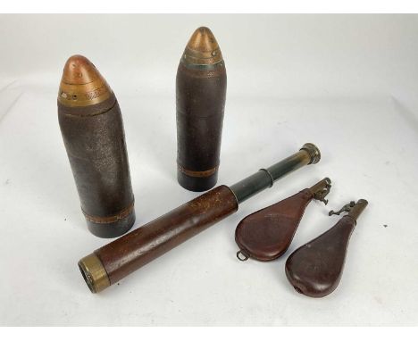 Two 19th century leather shot flasks, together with two shells and a leather covered brass scope by Broadhurst Clarkson &amp;