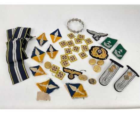 George V silver Swastika bangle (Birmingham 1923), together with a group of replica Nazi and other cloth patches and badges.