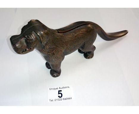 A cast dog nut cracker