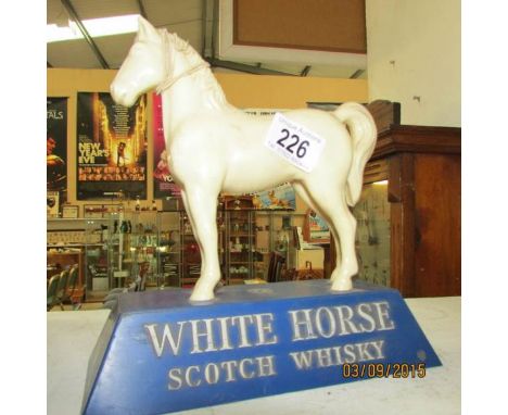 A White Horse scotch whisky advertising figure