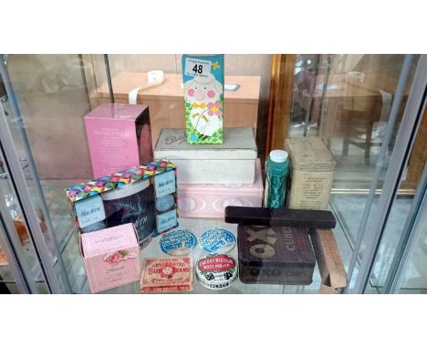 A shelf of advertising toiletries etc.