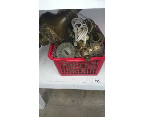 A crate of oil lamp burners etc.
