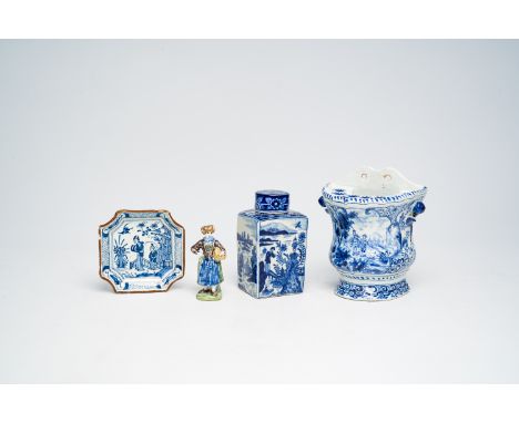 Full title: A varied collection of Dutch Delft blue and white items with figures in a landscape and a polychrome figure of a 