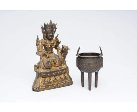 Full title: A Chinese partly gilt bronze figure of Guanyin and a tripod incense burner, 19th/20th C.Description:H 25 cm (the 